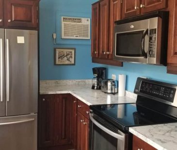Kitchen features stainless appliances, ice maker, convection oven, microwave and dishwasher