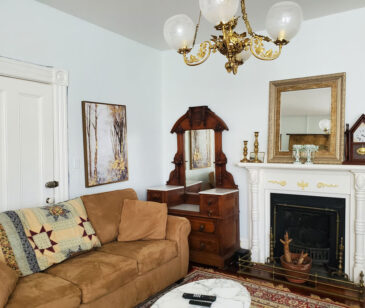 Gorgeous living room with 2 sofas, antiques, fireplace